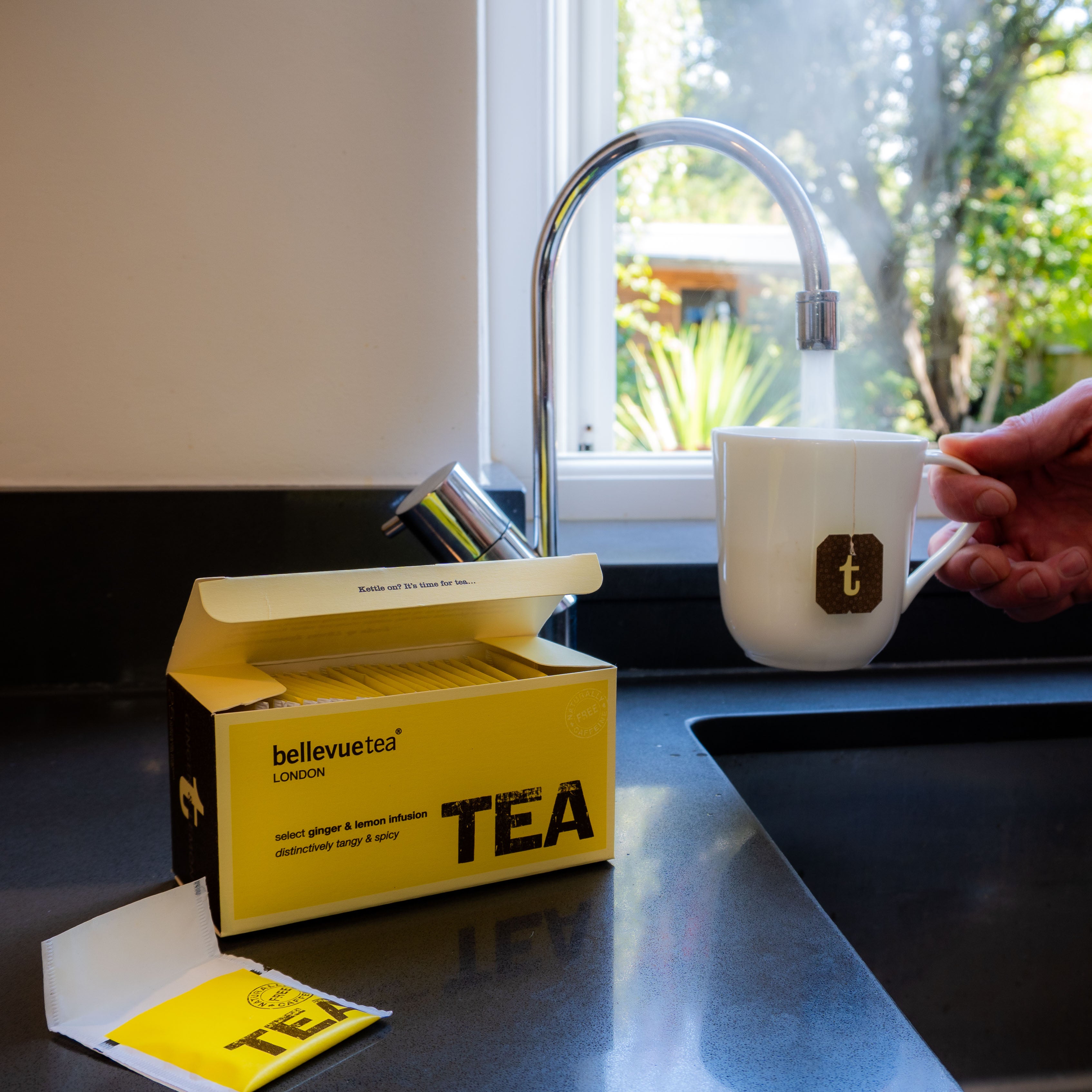 Cup of Bellevue Tea Ginger and Lemon Infusion Being Poured – Caffeine-Free Warming Herbal Tea