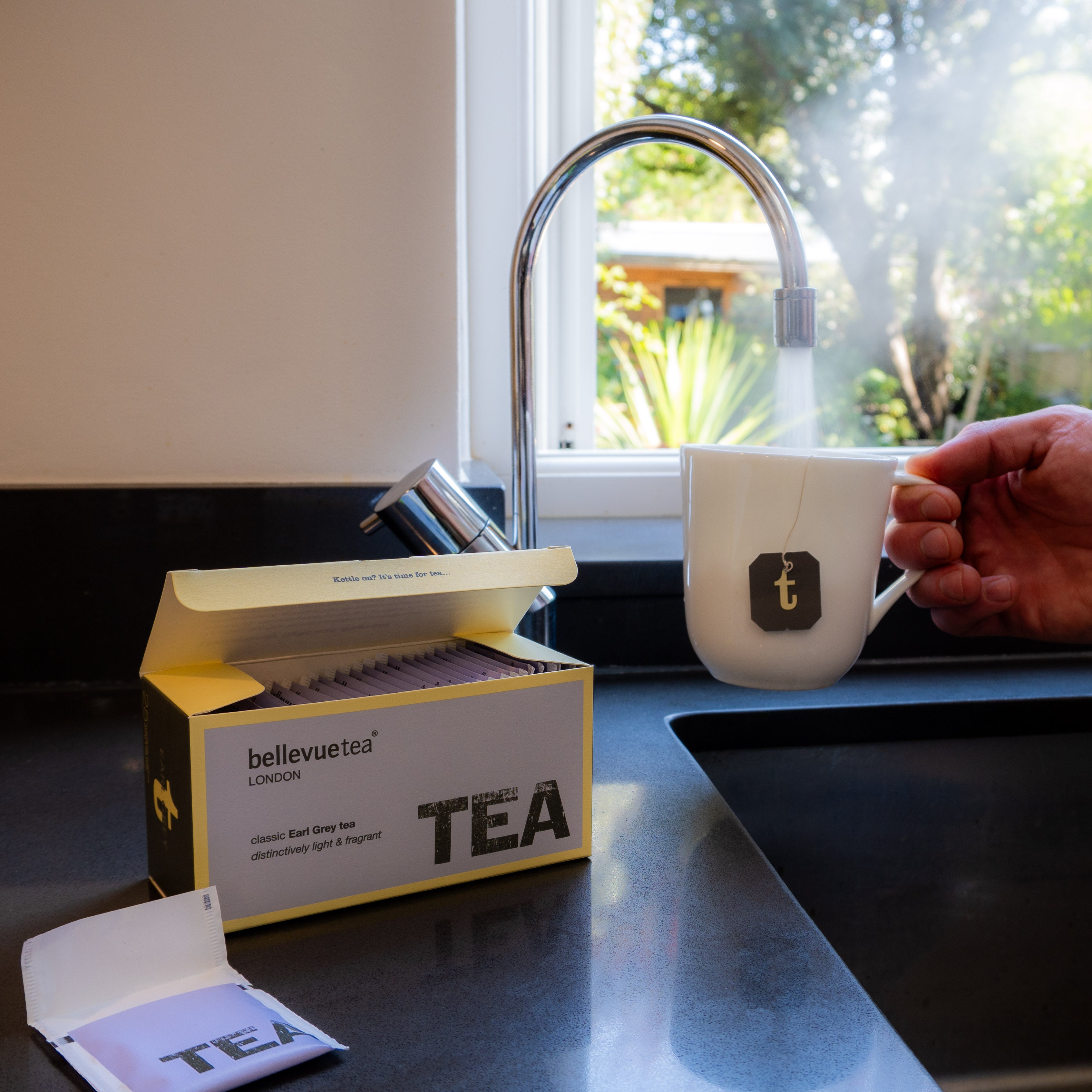 Cup of Bellevue Tea Earl Grey Being Poured – Classic Bergamot Infused Black Tea