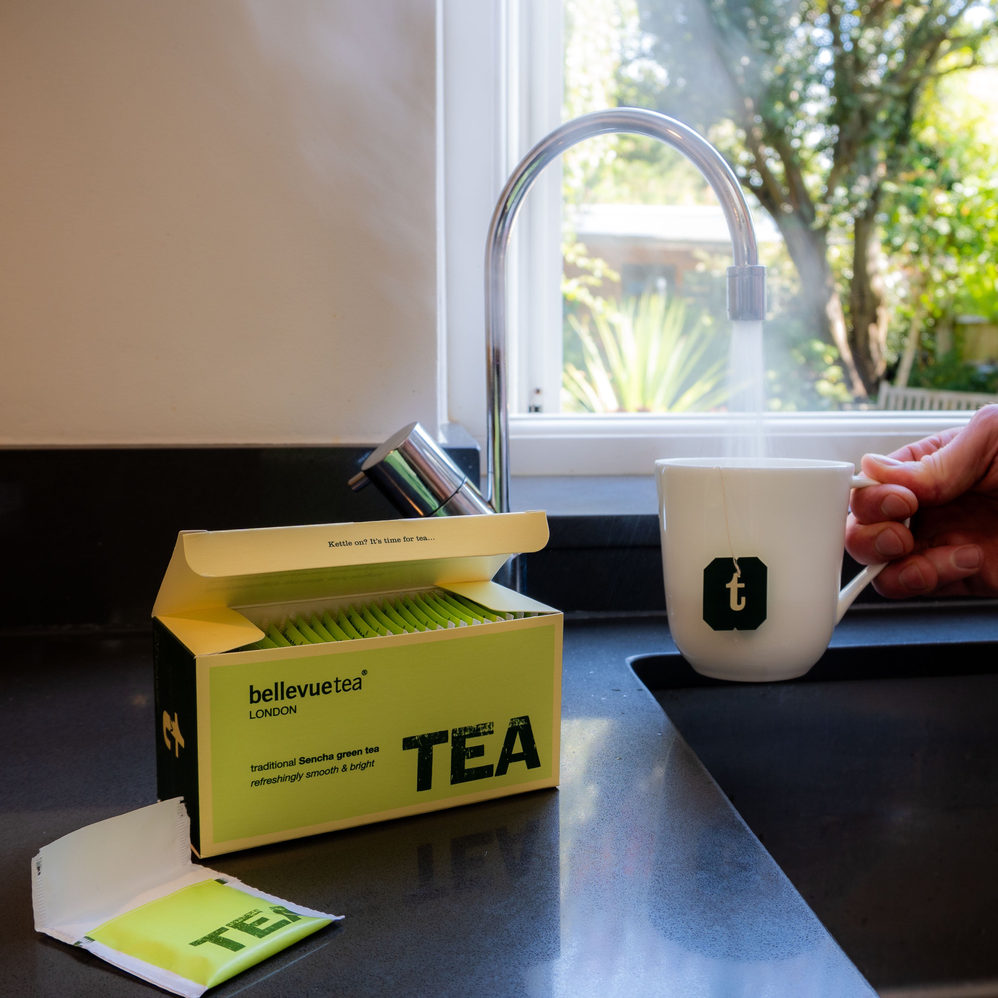Cup of Bellevue Tea Sencha Green Tea Being Poured – Light Japanese Green Tea Antioxidants