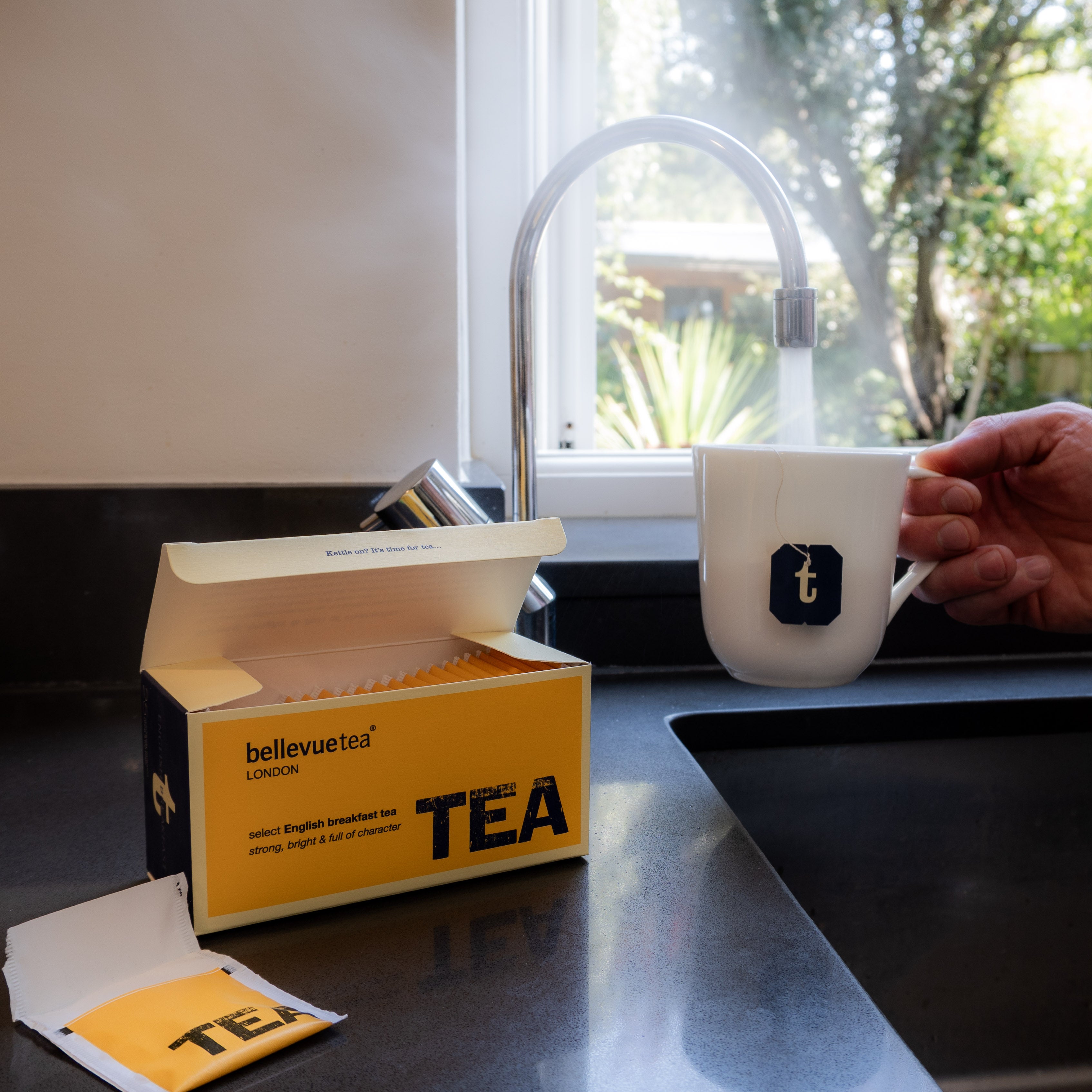 Cup of Bellevue Tea English Breakfast Being Poured – Rich Full-Bodied British Breakfast Tea