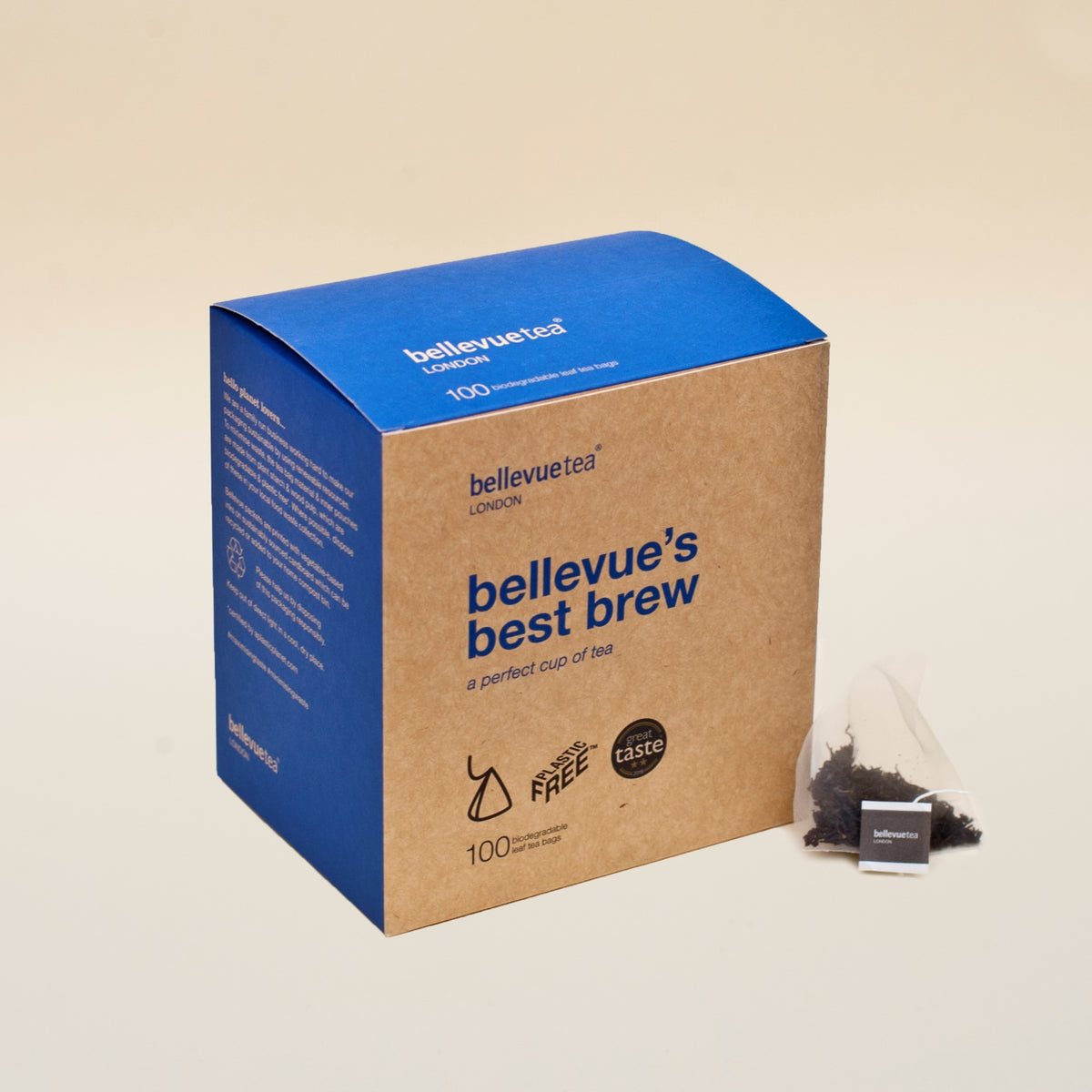 A box of bellevue's best brew tea bags with a few tea bags visible in front, showcasing the product packaging which is predominantly blue and brown with text and branding.